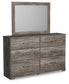 Ralinksi King Panel Bed with Mirrored Dresser