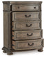 Ardenfield King Upholstered Sleigh Bed with Mirrored Dresser and Chest