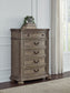 Ardenfield King Upholstered Sleigh Bed with Mirrored Dresser and Chest